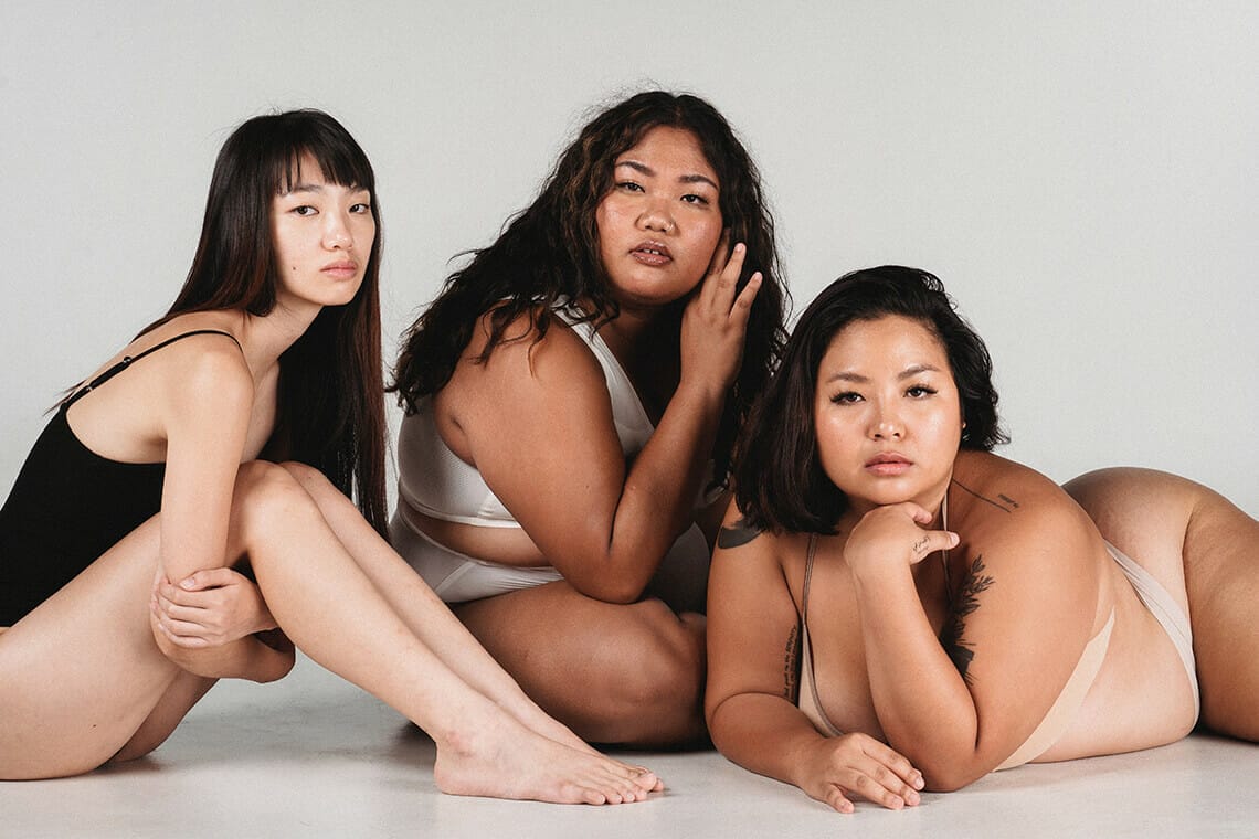 three women of varying body shapes