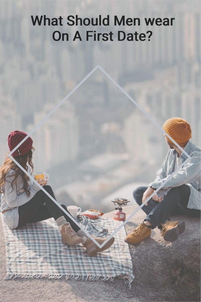 a couple on a date sat on a picnic blanket